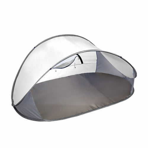 IMINIS instant beach tent folded flat inside its circular black carry bag.