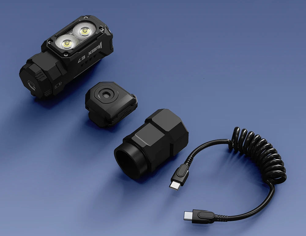 Black Head LED light and coiled USB cable on a blue background