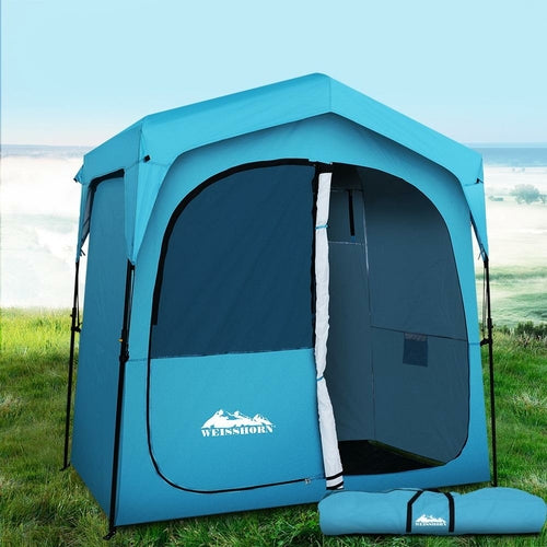WIMINIS pop-up privacy tent in blue, set up outdoors for camping.